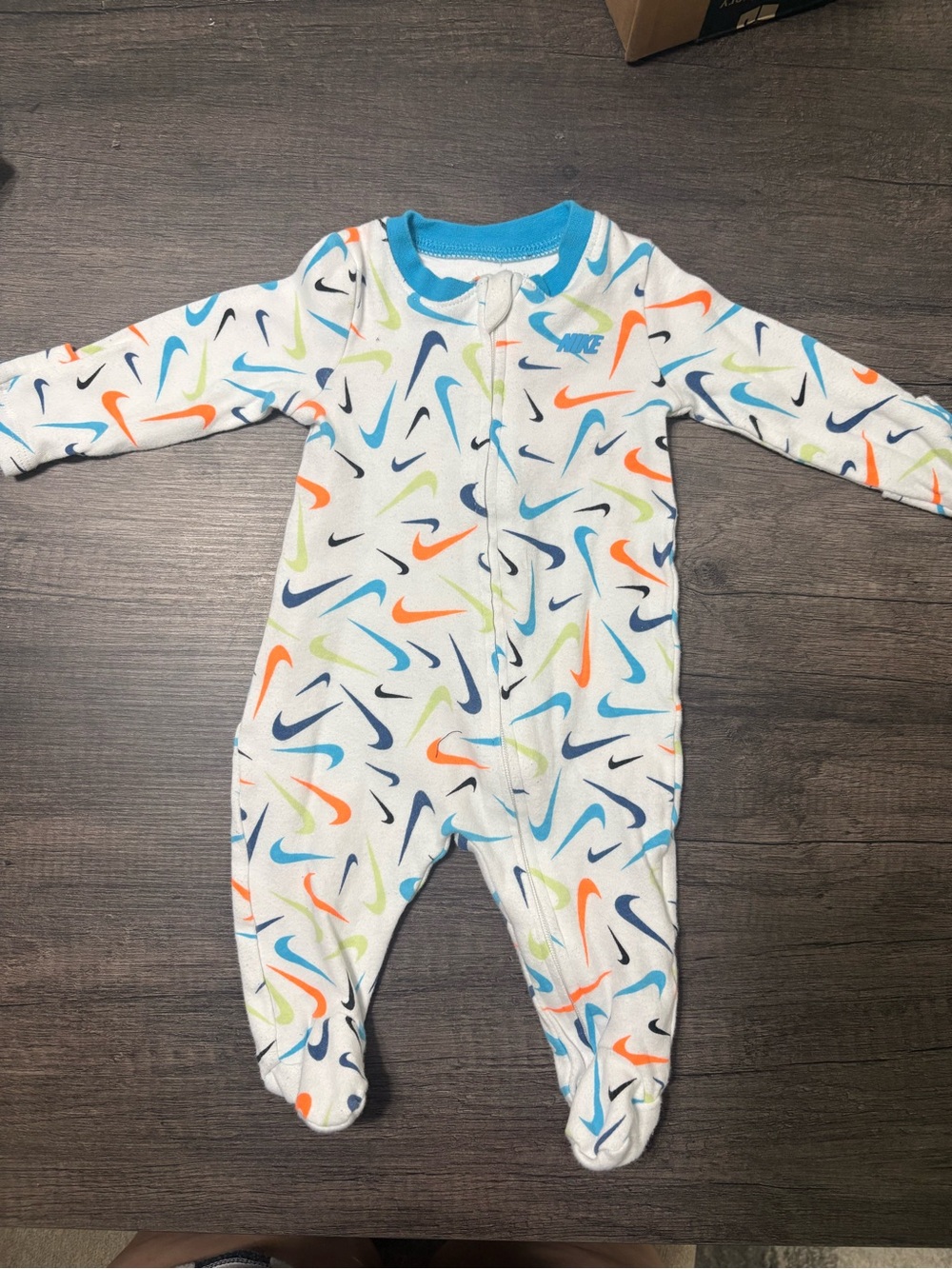 Nike White Footed One-Piece with Multicolor Swoosh Print